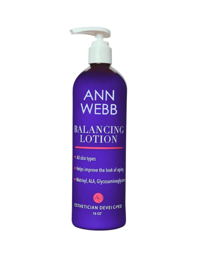 Purple bottle of Ann Webb Balancing Lotion on a white background