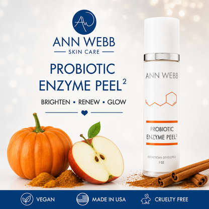 Ann Webb Skin Care Probiotic Enzyme Peel 1 oz bottle shown on a white background with promotional text, plus pumpkin, apple, and cinnamon imagery suggesting ingredients. The image includes Ann Webb branding and badges reading Vegan, Made in USA, and Cruelty Free.
