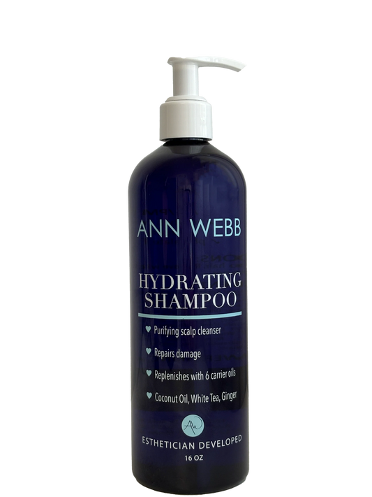 A 16 oz pump bottle of Ann Webb Hydrating Shampoo, featuring a dark navy blue bottle and a white pump dispenser, set against a plain white background.