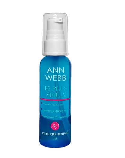 A 2 oz blue pump bottle of Ann Webb B5 Plus Serum with a white cap, shown on a plain white background.