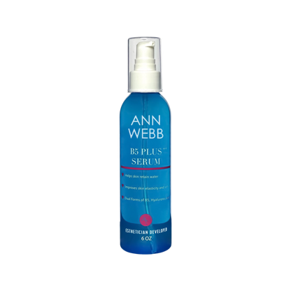 A 6 oz blue pump bottle of Ann Webb B5 Plus Serum with a clear cap, shown on a plain white background.